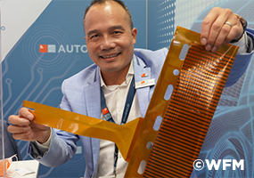 Luat Nguyen shows flexible printed sensors on thin foil